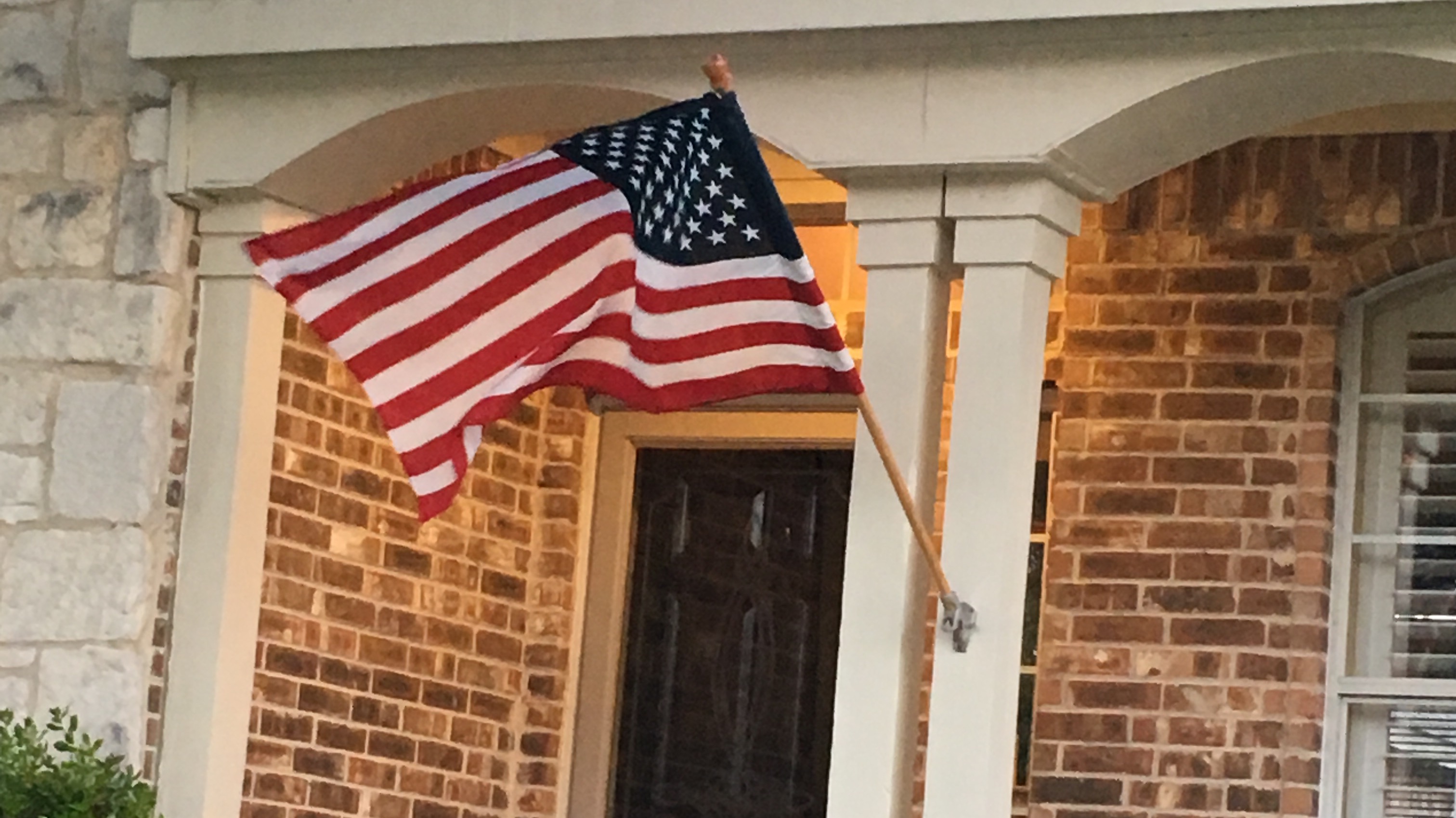 House flying the US Flag at Arbor Lakes